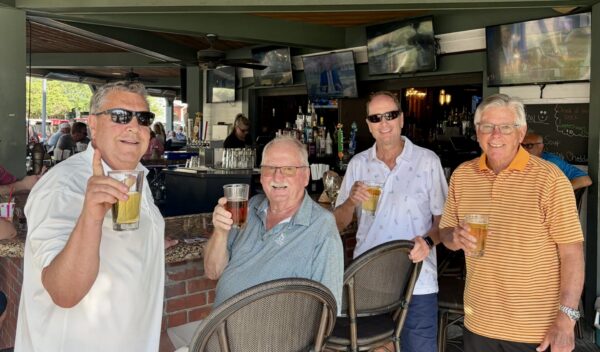 Villager John Grham, third from left, bought the drinks at City Fire after getting his first lucky ace Villager John Graham, third from left, bought the drinks at City Fire after getting his first lucky ace