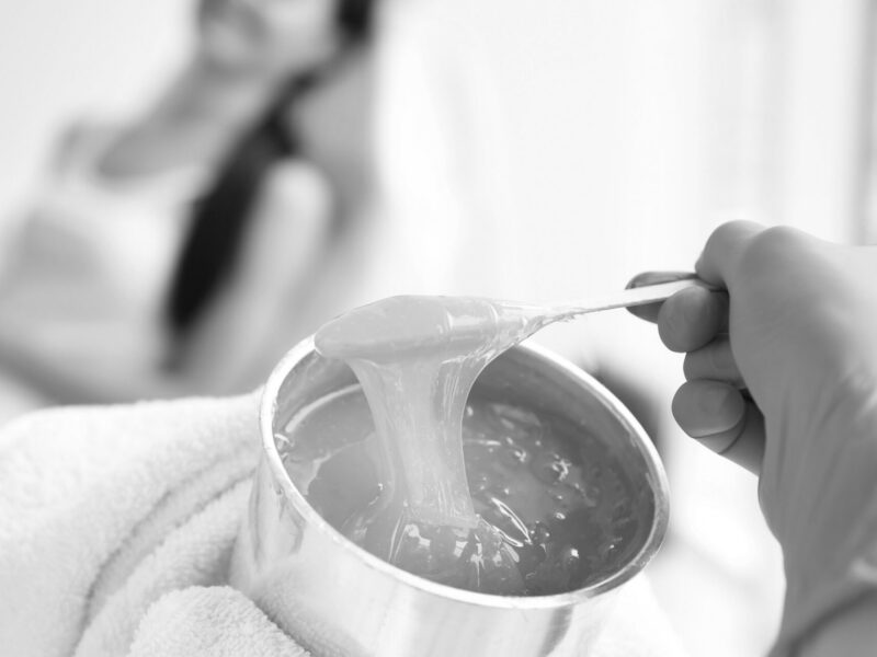 Wax being used for a treatment at a Brazilian wax studio