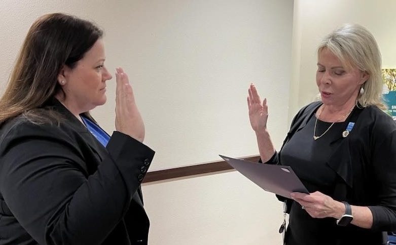 Amanda McLea, left, took the oath of office Monday night and joined the Lady Lake Commission