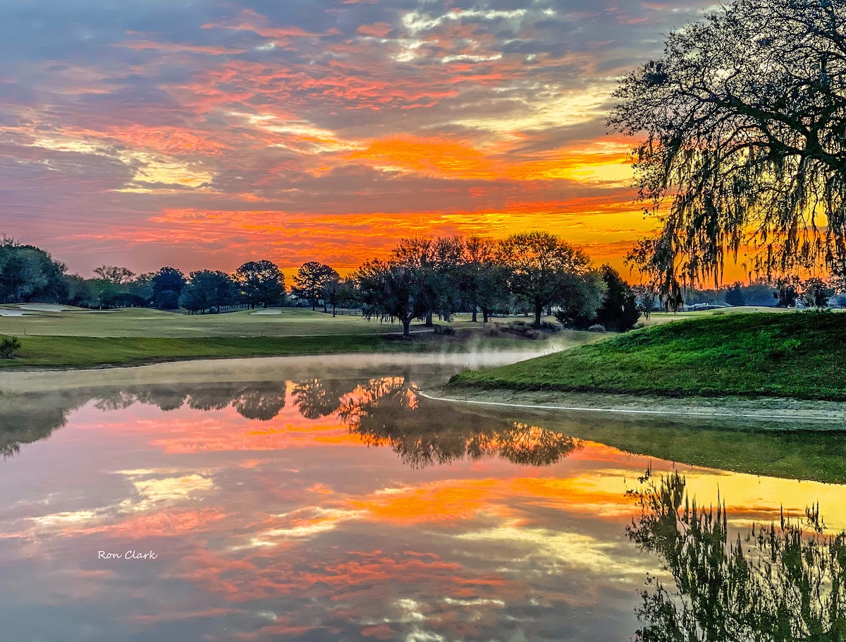 Breathtaking sunrise reflects over the water at Briarwood Executive Golf Course Breathtaking sunrise reflects over the water at Briarwood Executive Golf Course