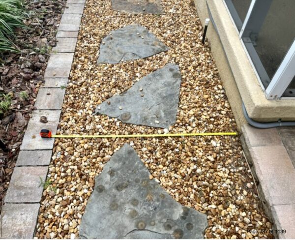 Even though this walkway is not in copmliance, John Davis contends it is aesthetically pleasing. Even though this walkway is not in copmliance, John Davis contends it is aesthetically pleasing.