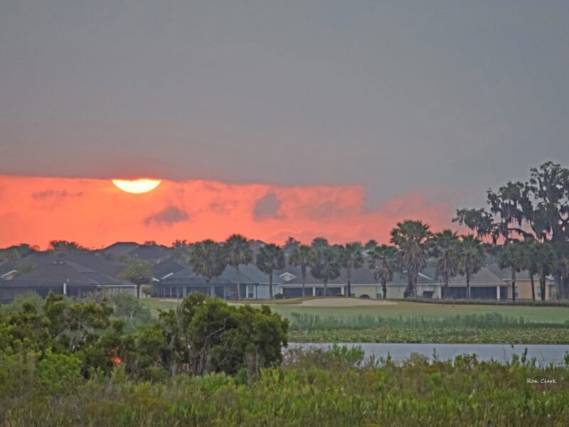 Fiery sunrise peeks over Riley Grove Course at Palmer Legends