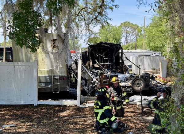 Fire fighters battled the RV fire in 94 degree temperatures Thursday afternoon Fire fighters battled the RV fire in 94 degree temperatures Thursday afternoon