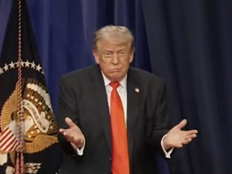President Donald Trump emerges from behind the curtain in The Villages. May 1, 2026