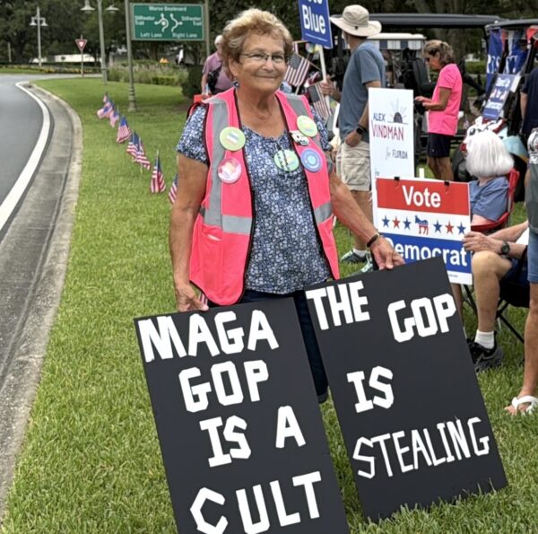 Several Villagers displayed signs attacking MAGA and the GOP