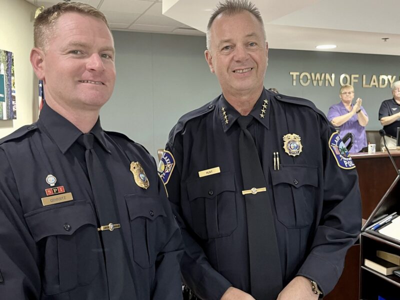 Sgt. Charles Gehrsitz, left, with Chief Steven Hunt, at Monday night s commission meeting