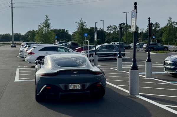 The luxurious British sports car did not have a handicapped plate and did not appear to have a handicapped placard of any kind The luxurious British sports car did not have a handicapped plate and did not appear to have a handicapped placard of any kind