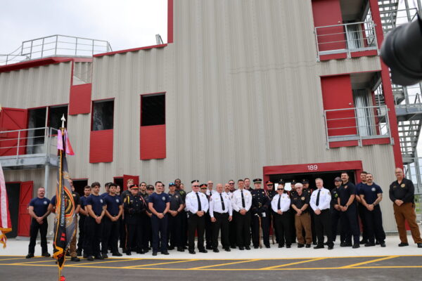 Firefighters posed for a photo at the joint training tower Firefighters posed for a photo at the joint training tower