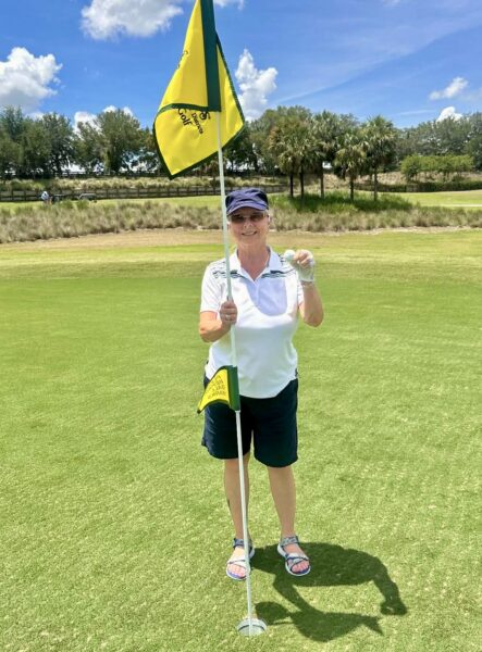 Karen Sharp shows off her golf ball after getting the lucky acd Karen Sharp shows off her golf ball after getting the lucky acd