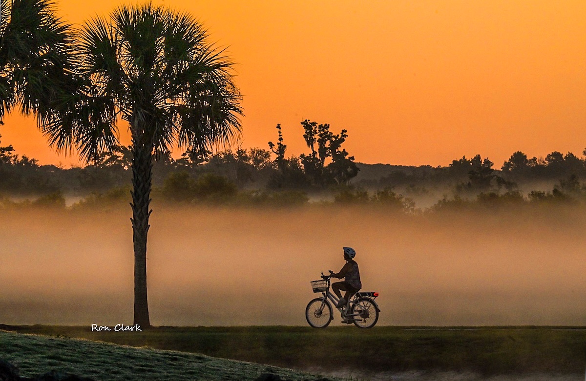 Misty sunrise paints the sky for a morning bike ride on Hogeye Pathway Misty sunrise paints the sky for a morning bike ride on Hogeye Pathway