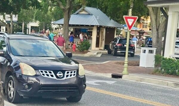 The driver of this car, on the left, parked it on Lakeshore Drive at Lake Sumter Landing while he went into Haagen Dazs to pick up some ice cream The driver of this car, on the left, parked it on Lakeshore Drive at Lake Sumter Landing while he went into Haagen Dazs to pick up some ice cream