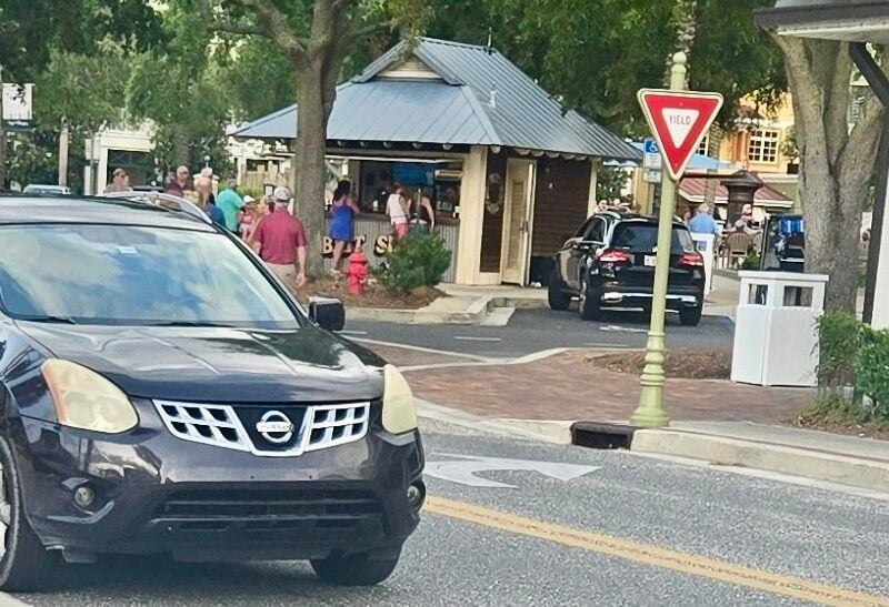 The driver of this car, on the left, parked it on Lakeshore Drive at Lake Sumter Landing while he went into Haagen Dazs to pick up some ice cream