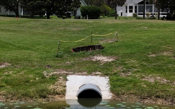 The sinkhole has been marked off with yellow tape The sinkhole has been marked off with yellow tape