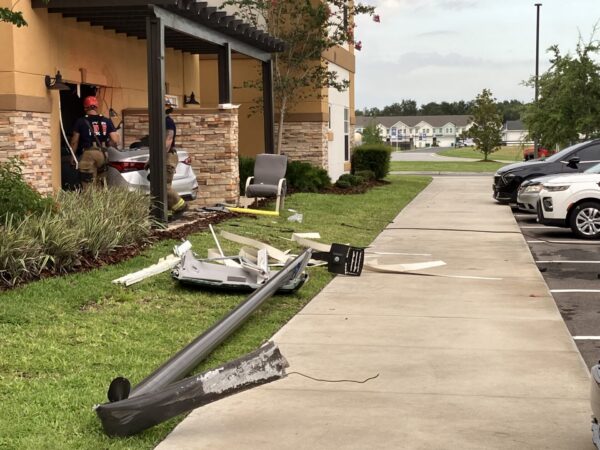 Before crashing into the building at Pebble Springs Retirement Community, the car took out a light pole Before crashing into the building at Pebble Springs Retirement Community, the car took out a light pole