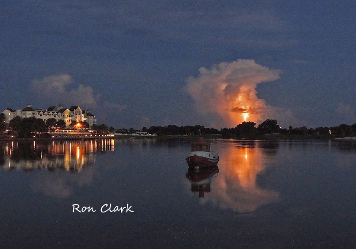 Distant lightning strike illuminates the night sky over Lake Sumter Landing Distant lightning strike illuminates the night sky over Lake Sumter Landing
