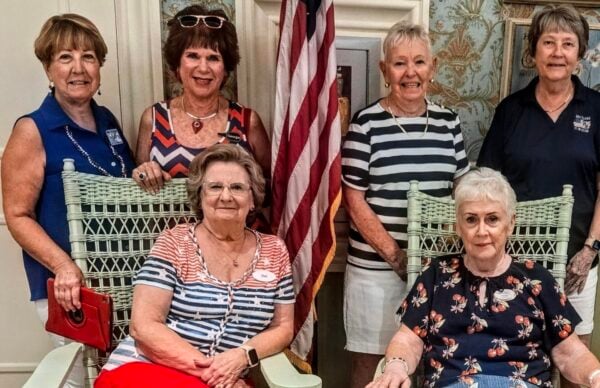 Mary Christopher, standing at left, organized the successful potluck for the Village of Hemingway in honor of Independence Day Mary Christopher, standing at left, organized the successful potluck for the Village of Hemingway in honor of Independence Day