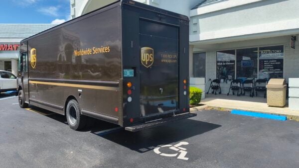 This UPS driver blocking the handicapped access ramp as well as a portion of a handicapped parking spot at the Spruce Creek Shoppes This UPS driver blocking the handicapped access ramp as well as a portion of a handicapped parking spot at the Spruce Creek Shoppes