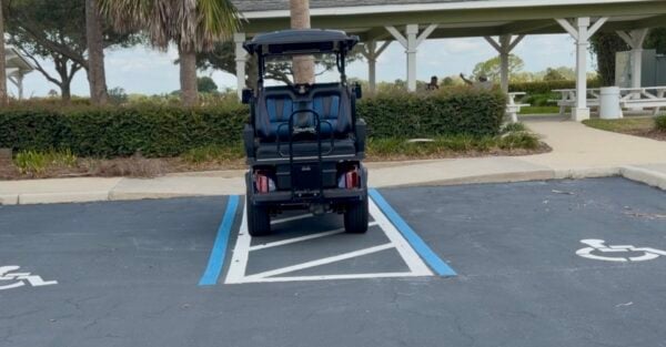 This golf cart driver parked in the handicapped accommodation zone at Coconut Cove Recreation Center This golf cart driver parked in the handicapped accommodation zone at Coconut Cove Recreation Center